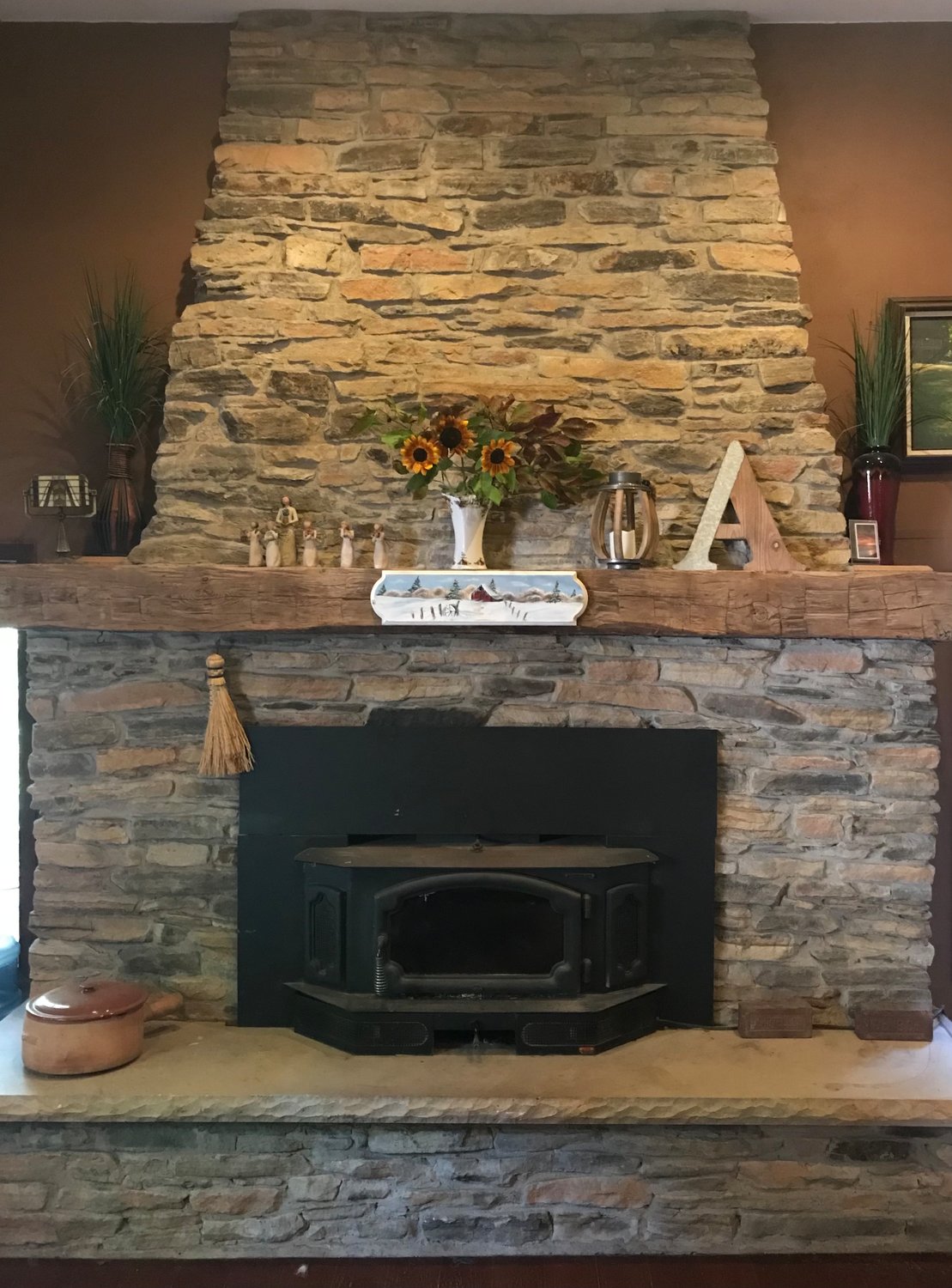Accessorize your fireplace with country touches.